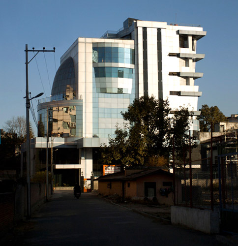 Shikhar Insurance Company office building or logo representing financial growth and premium collection.